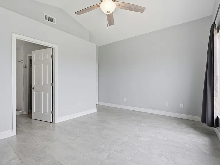 Master bedroom with vaulted ceilings