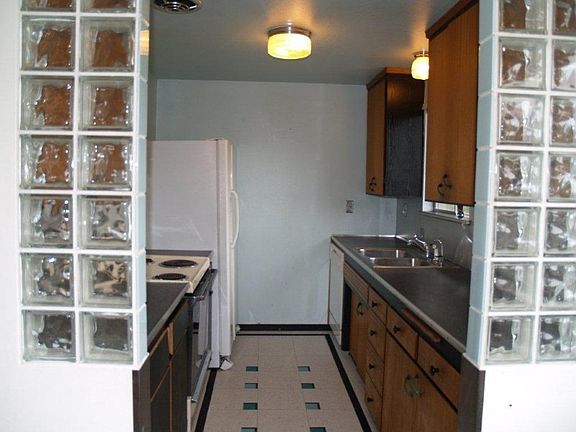 Large living/great room with beautiful oak hardwood floors and large masonry fireplace