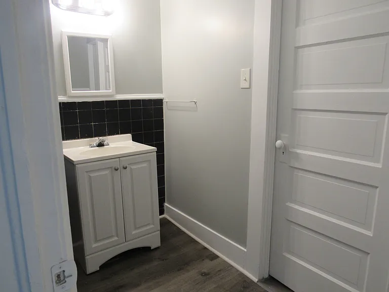 upstairs bath with toilet and shower through the door