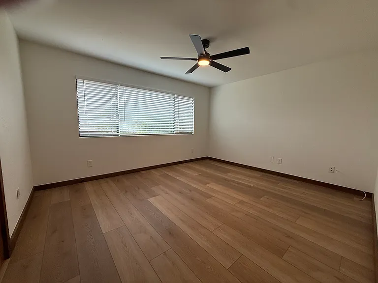 1 of 5 bedrooms. This one is directly off the kitchen and connects to a full sized bathroom with a shower.