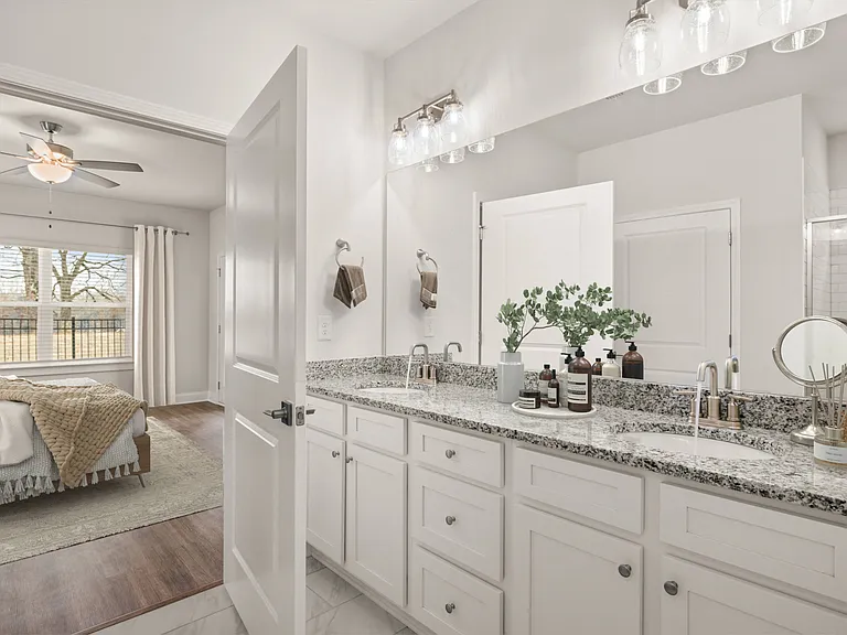 Elegant en suite with a double vanity off the primary bedroom.