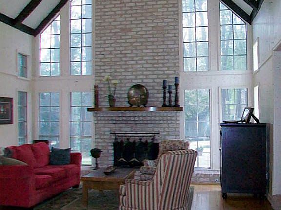 HARDWOOD FLOORS, CATHEDRAL CEILING, & SOARING FIREPLACE