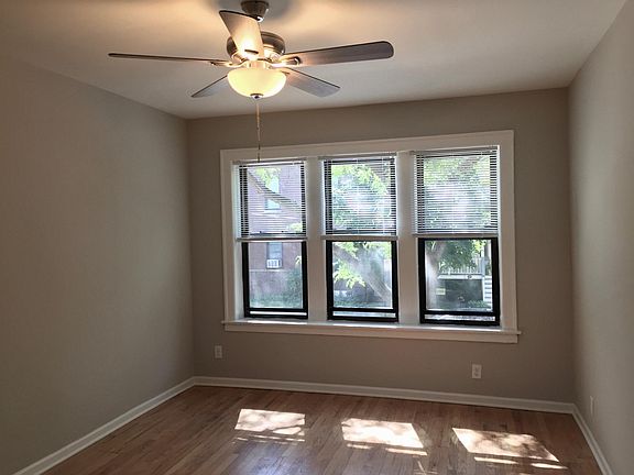 LIVING ROOM, WEST ESPOSURE, CEILING FAN, BLINDS, REFINISHED HARDWOOD FLOORS