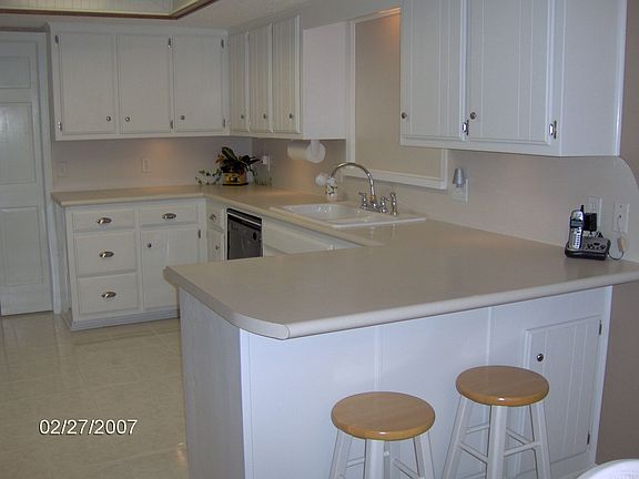 Light Bright updated kitchen with lots of cabinets and ceramic tile floors