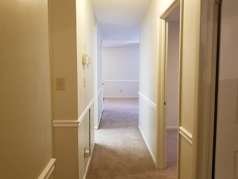 Hallway from bedrooms.
Bathroom and 1st bedroom on left.
Bedrooms 2 and 3 on right.