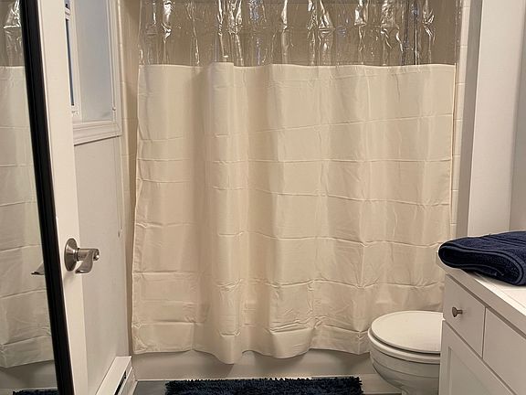 Bathroom adjacent to bedroom.