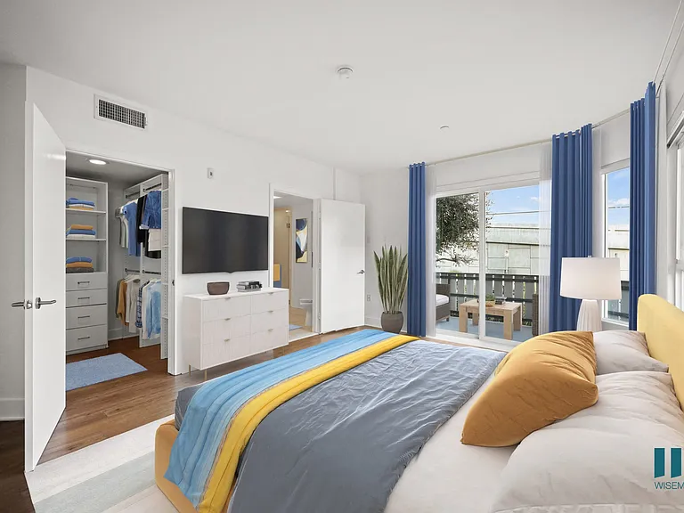 Spacious Primary Bedroom with Walk-In Closet, Bathroom, and Patio