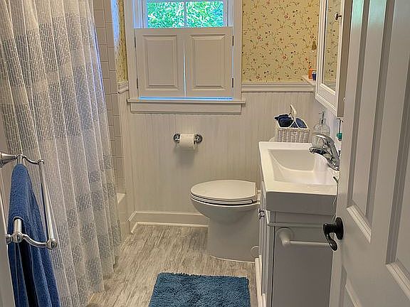 Upstairs bathroom with tub