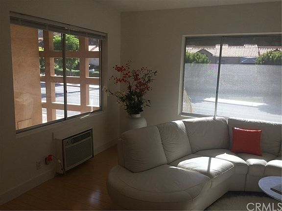 From your living room, enjoy more mountain views. Note the Mid Century architectural detail outside the window