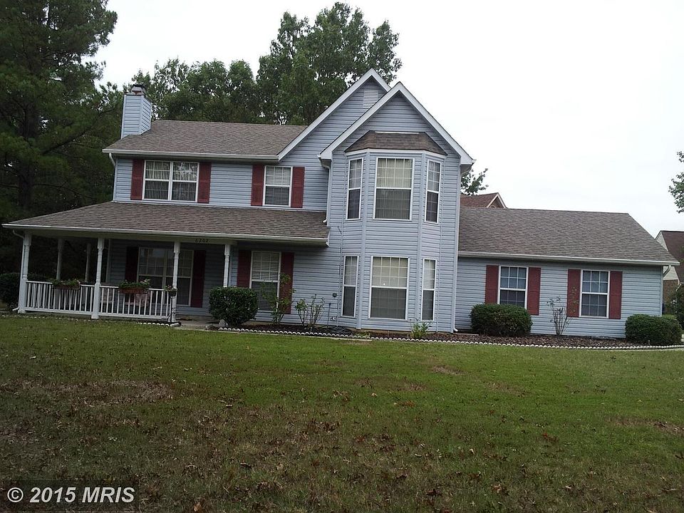 Wraparound porch and side entry garage