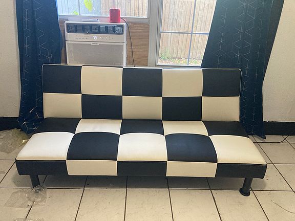 futon couch in living room, it's super cool