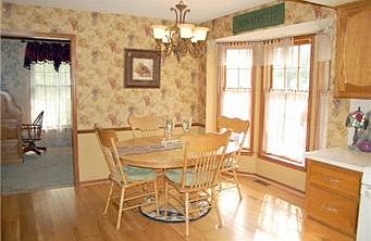 Light and Bright Breakfast Area with New Fixture and Built-in Desk