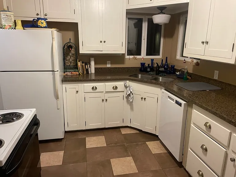 new granite countertops and tile flooring
