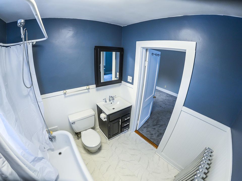 Remodeled bathroom with large claw foot tub.