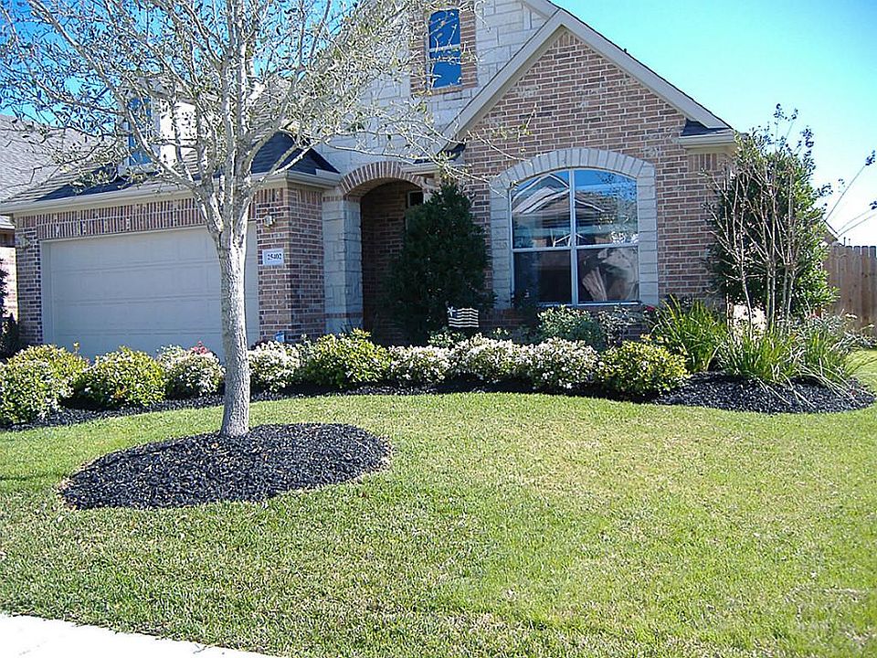 Great former model. Lots of landscaping and beautiful corner lot