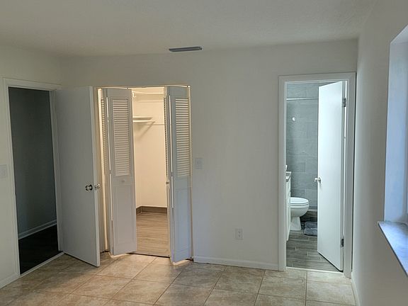 Master bedroom with walk-in closet and bathroom