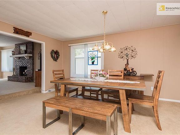 The dining room flows to the kitchen and first family room.