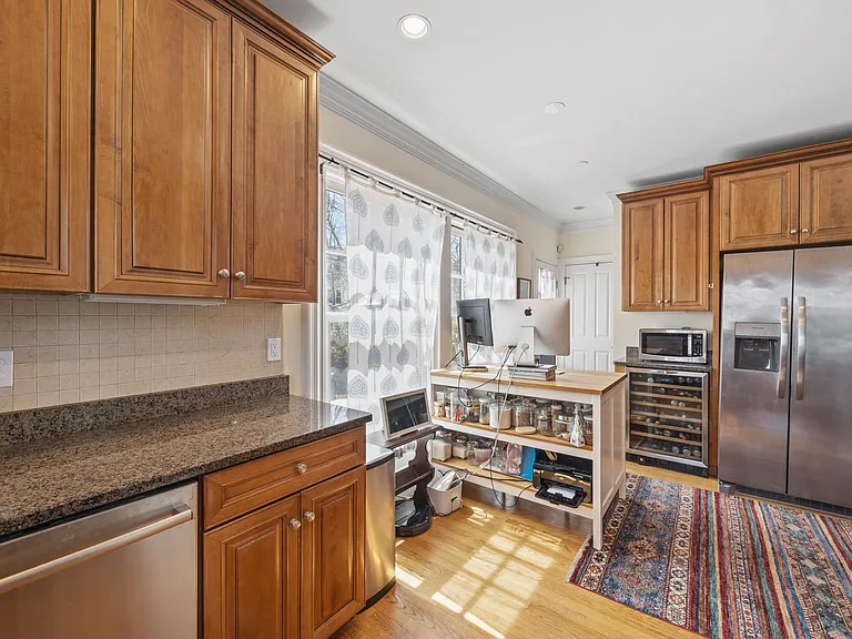 Office nook in kitchen overlooking exclusive patio and yard