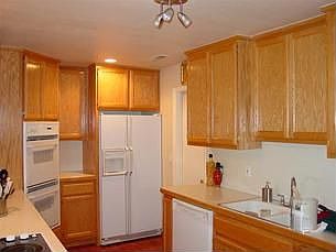 Kitchen opens to Laundry Room and Garage