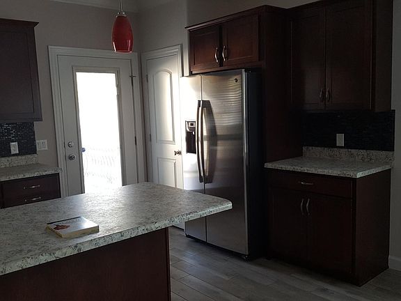 Kitchen showing high-end cabinetry and stainless steel appli
