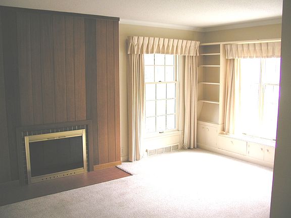 Lots of light, built-ins and fireplace in the living room