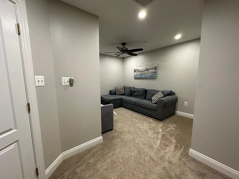 Second floor contains two guest bedrooms, den, one full bathroom,