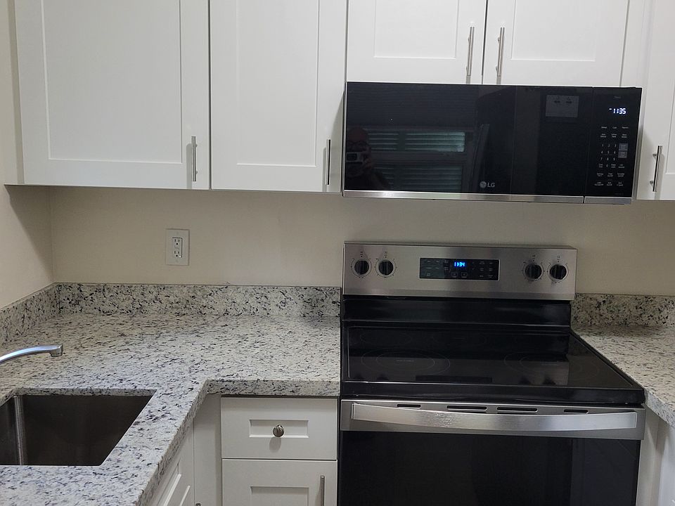 brand new cabinets and appliances; slimline microwave and glass top range with self cleaning oven