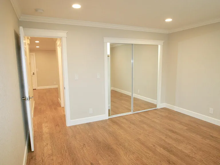 Closet has LED tube light and steel hanging bar to carry heavy clothing weight.
