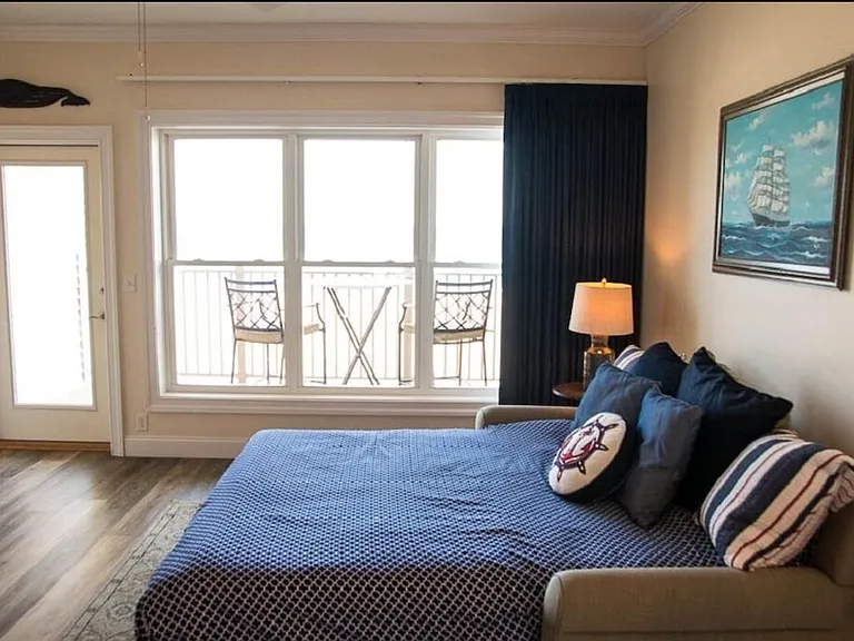 Extra sleeper in living room for occasional guests.