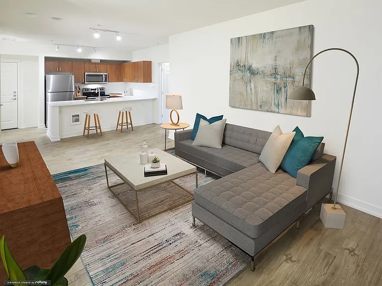 Renovated Package I kitchen and living area with hard surface flooring