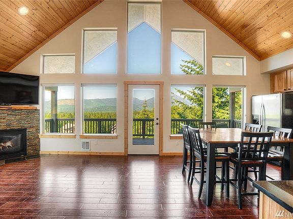 Great Room concept with wall of floor-to-ceiling windows to capture the views from almost every room in the house. 