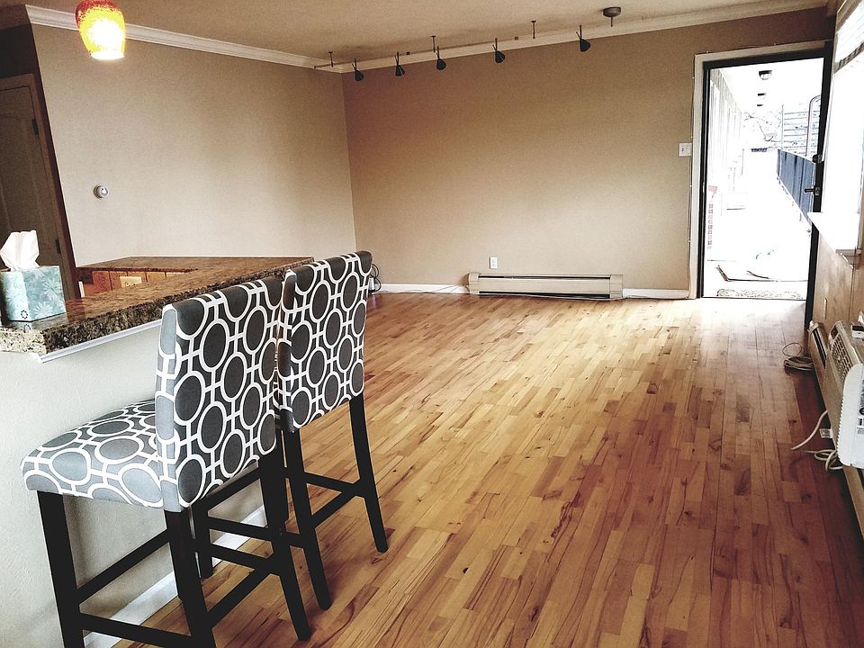 Dining room looking onto bar and living room