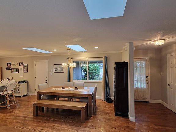 Dining area with skylights and recessed lights