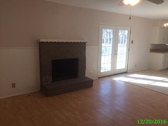 Living room with wood burning fireplace