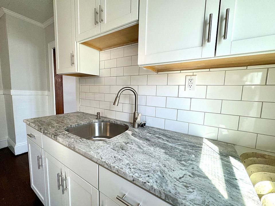 New cabinets, quarts countertop, stainless moen faucet