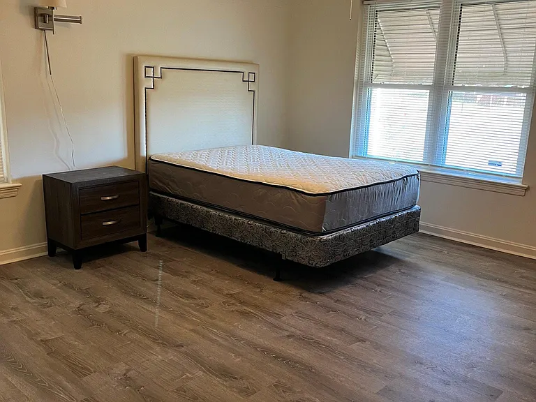 Room A - Bed, nightstand and window to front of house/yard