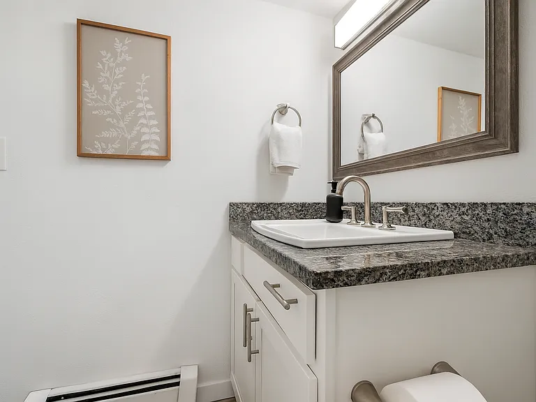 This simple, cozy bathroom offers a relaxing space to refresh and reset