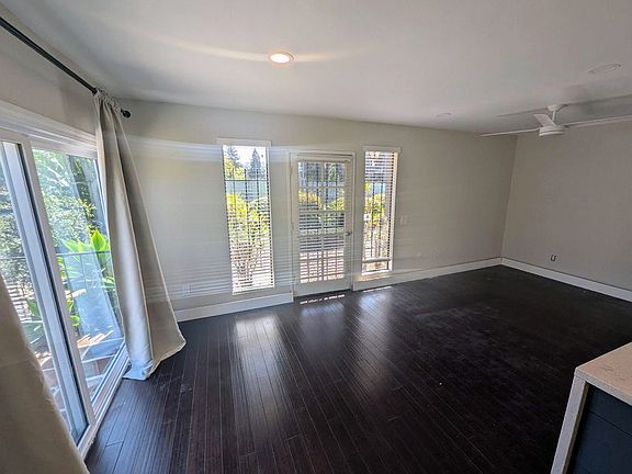 Standing in the kitchenette looking towards dining/office space on the left and living space on the right.