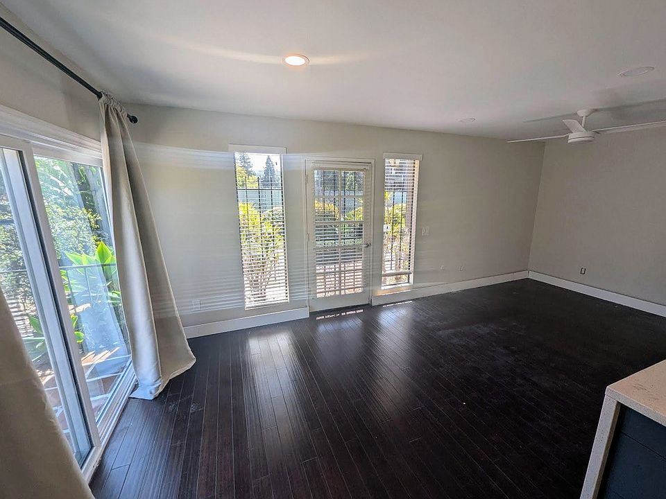 Standing in the kitchenette looking towards dining/office space on the left and living space on the right.
