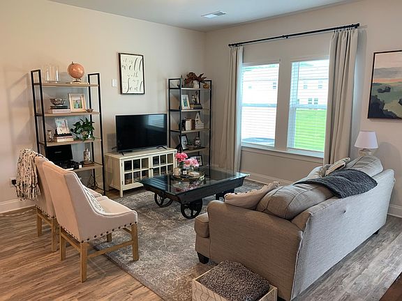 Living room with large window. Natural light all day!
