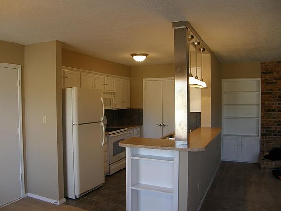 Dining into kitchen with laundry room at end