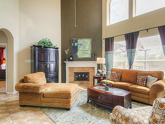 Family Room with two story ceiling offers plenty of room for big comfortable chairs and sofas.