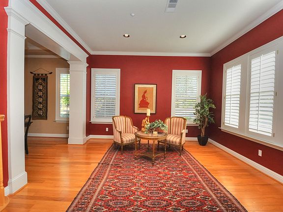 Elegant Formal Living Room features Wood Cased Doors and Windows