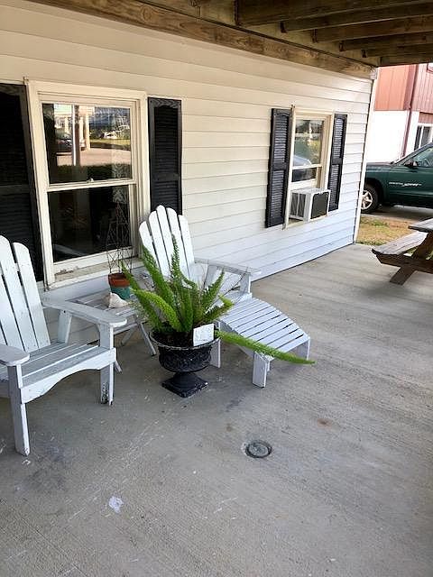 Covered front porch area with picnic table