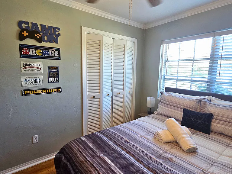 Queen bed with premium linens for ultimate comfort and restful sleep.