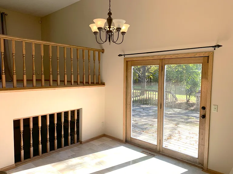 Dining room with patio door to large deck