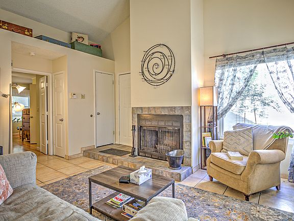 Cathedral ceilings makes that place feel larger than it is. Lots of natural light floods this living room.