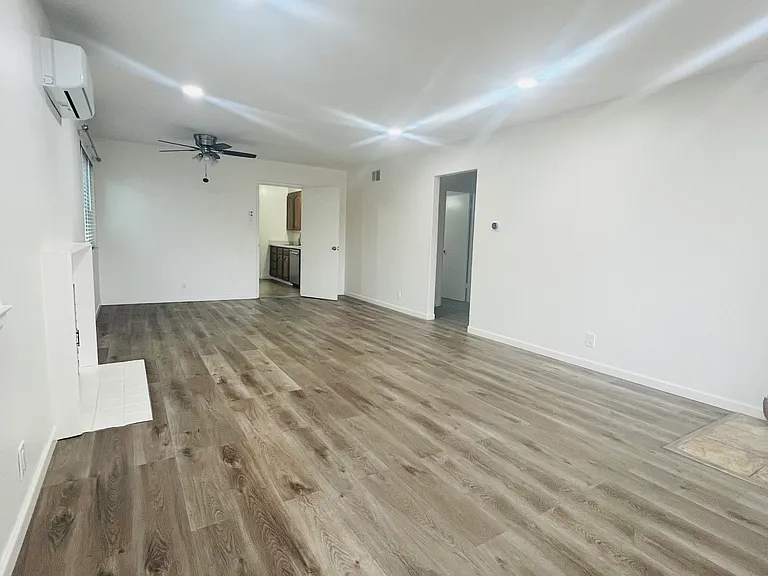 Spacious living area with recess lighting