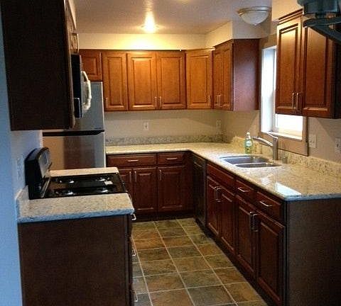 Uprgraded Kitchen with granite slabs and new stainless appli