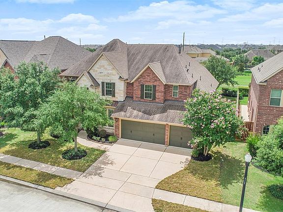 3-car garage with wide driveway provides plenty of room for parking.